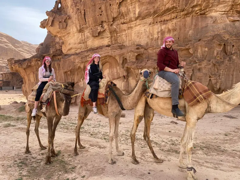 Camel ride through the desert landscape of Wadi Rum Jordan