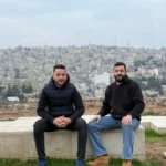 sami with his friend with view in amman